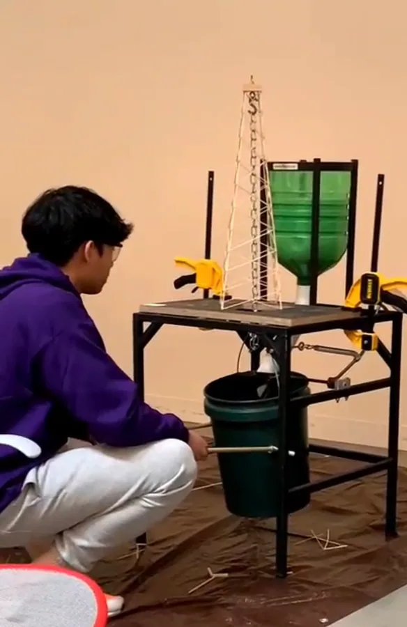Arvino Mahadi testing a Science Olympiad tower.