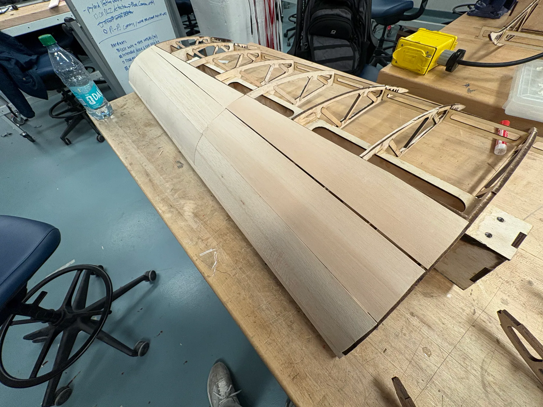 Balsa wing structure with leading-edge paneling in progress.